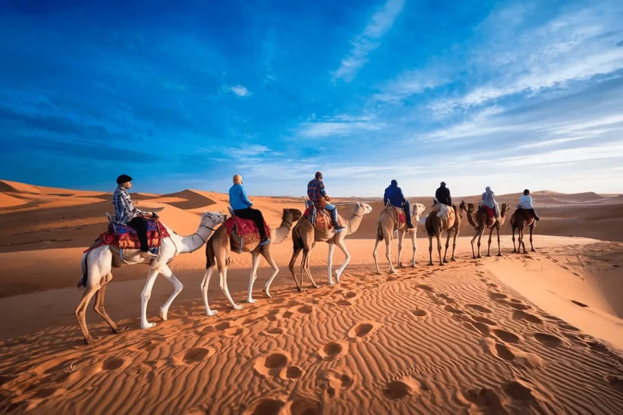 Group of travelers enjoying the desert dunes during a 3 days tour from Marrakech to Merzouga, 2 Day Desert Tour from Marrakech to Zagora